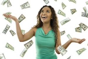 Stock image of woman standing with open arms amidst falling money